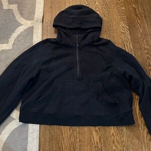 Black LuLuLemon quarterback zip, I’d say fits like a large but no size tag